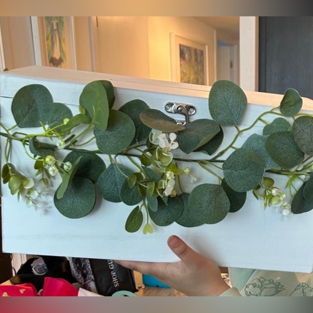 Michaels Faux Eucalyptus Garland with White Blossoms
